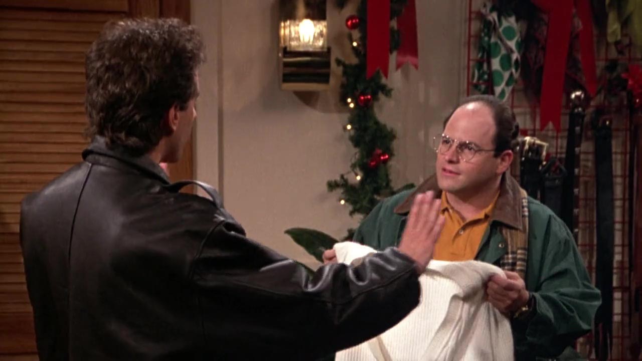Jerry: I see a very cheap man holding a sweater trying to get away with something. That